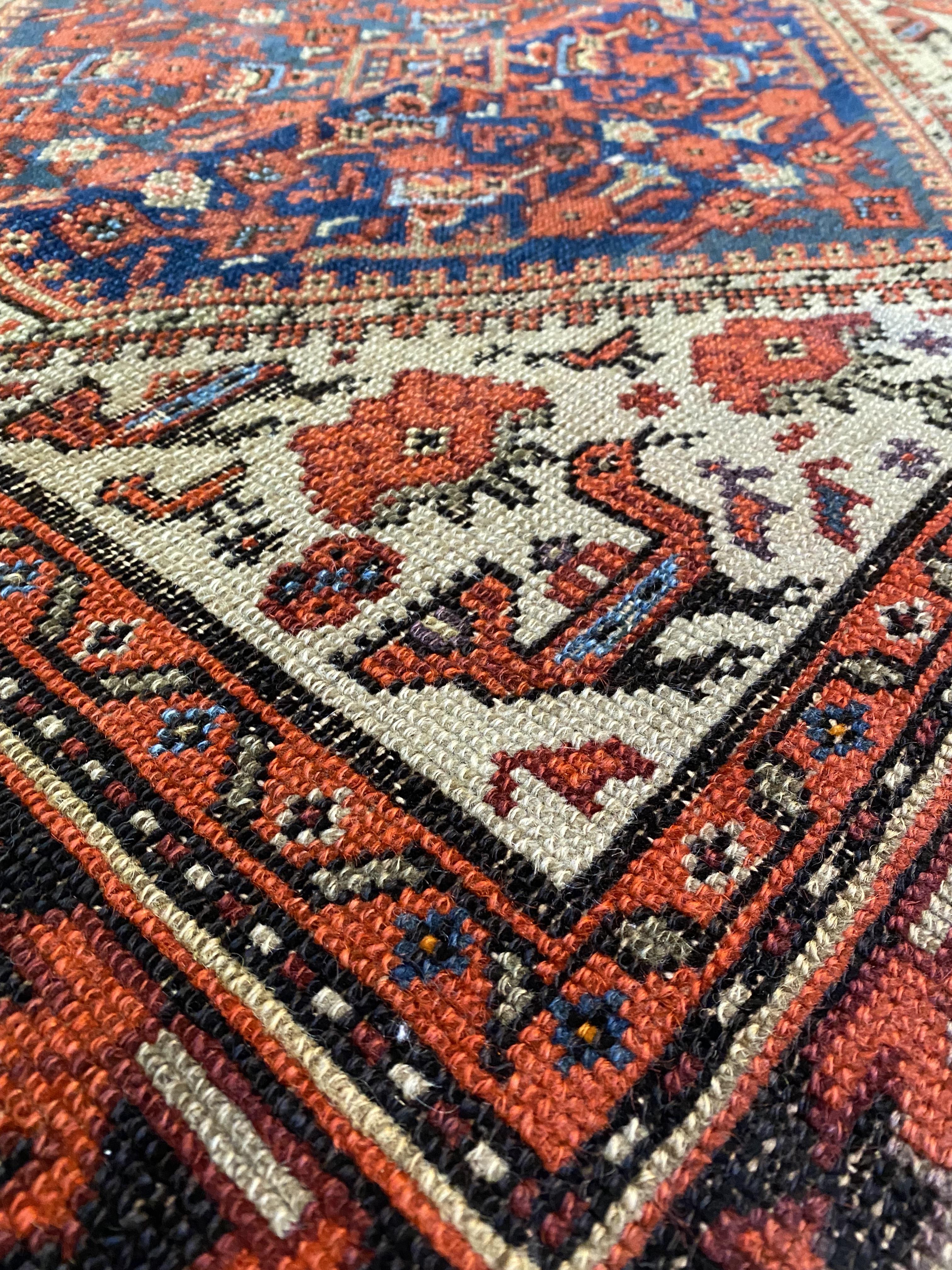 An old Caucasian runner rug, the central field with pole medallion and stylised bird motif, 407cm - Image 2 of 3