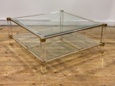 Pierre Vandal of Paris, a two tier coffee table, each tier inset with bevelled glass, raised on gilt