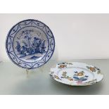 A Delft dish, probably Liverpool, c. 1760, painted with floral sprays in Fazackerly colours (cracks,
