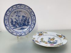 A Delft dish, probably Liverpool, c. 1760, painted with floral sprays in Fazackerly colours (cracks,