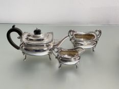 An Edwardian three piece silver tea service, Henry Williamson Ltd, Birmingham 1909, each piece of