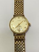 A Longines 18ct gold gentleman's wristwatch, the circular silvered dial with Arabic numerals and
