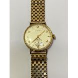 A Longines 18ct gold gentleman's wristwatch, the circular silvered dial with Arabic numerals and