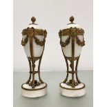 A pair of Louis XVI style gilt-metal mounted alabaster cassolettes, each ovoid urn with reversible