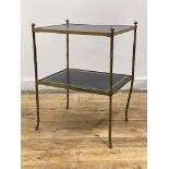 A mid 20th century brass faux bamboo two tier etagere, each tier inset with gilt tooled leather,