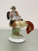 A large Herend porcelain group of a boy riding a cockerel, mid-20th century, blue printed mark and
