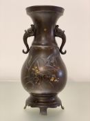 A Japanese mixed metal and bronze twin-handled vase, Meiji period, c. 1900, of baluster form, with