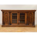 A mid 19th century burr walnut credenza, the top with floral cast gallery over twin glazed doors