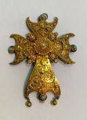 A 19th century Maltese cross pendant, worked in unmarked yellow metal with filigree work, set with
