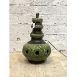 A large ceramic table light, circa 1970, of pierced baluster form with green and brown glaze,