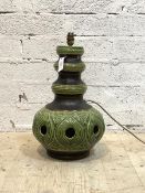 A large ceramic table light, circa 1970, of pierced baluster form with green and brown glaze,