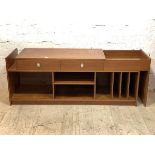 An unusual mid century teak hi-fi sideboard, the top with two drawers and a well, extending to the