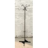 A 1980's post modern coat and umbrella stand, of black and chrome tubular construction with drip