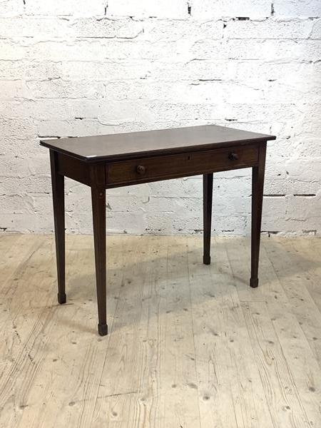 A Georgian inlaid mahogany side table with frieze drawer, raised on square tapered supports,