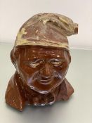 A Scottish pottery model of Souter Johnny flagon, missing stopper, with partial decoration (29cm x