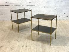 A pair of mid century lamp tables, each with two tiers having inset tooled leather surface, on a