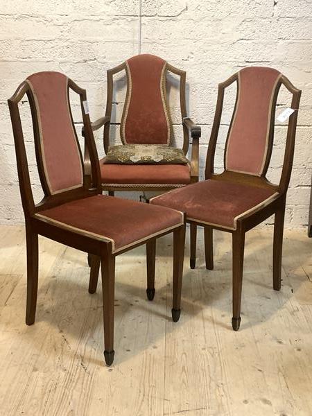 A set of three (2+1) Edwardian mahogany chairs, with upholstered back and seat, scrolled open arms