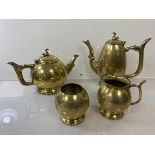 An Epns gilt tea and coffee service (coffee pot: 20cm), with swan finials, teapot, sugar bowl and