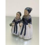 A Royal Copenhagen porcelain figure group, Two Young Girls in Traditional Costume