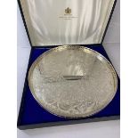 A Hamilton & Inches Epns circular drinks tray with raised edge and foliate engraved top, inscribed