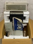 An Amstrad PCW 8256 personal computer word processor with keyboard, monitor, built in disk drive and