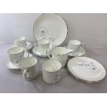 A Susie Cooper White Wedding pattern coffee set including four coffee cups and saucers, a cake plate