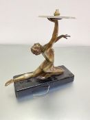 An Art Deco bronzed metal Dancing 1920s figure, with arm upraised, mounted on rectangular black