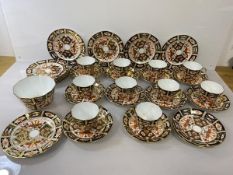 An early 20thc Royal Crown Derby Imari pattern teaset including ten cups, one with repairs (6cm),