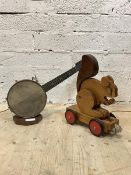 A table light in the form of a banjo, on an octagonal wooden base, (H37cm) together with a child's