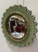 A 1930s green and gilt circular convex mirror with carved sunburst style frame (mirror: d.19cm