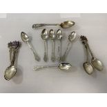 A set of six silver coffee spoons, Edinburgh 1895, makers mark WM, with spiralled stems and initials