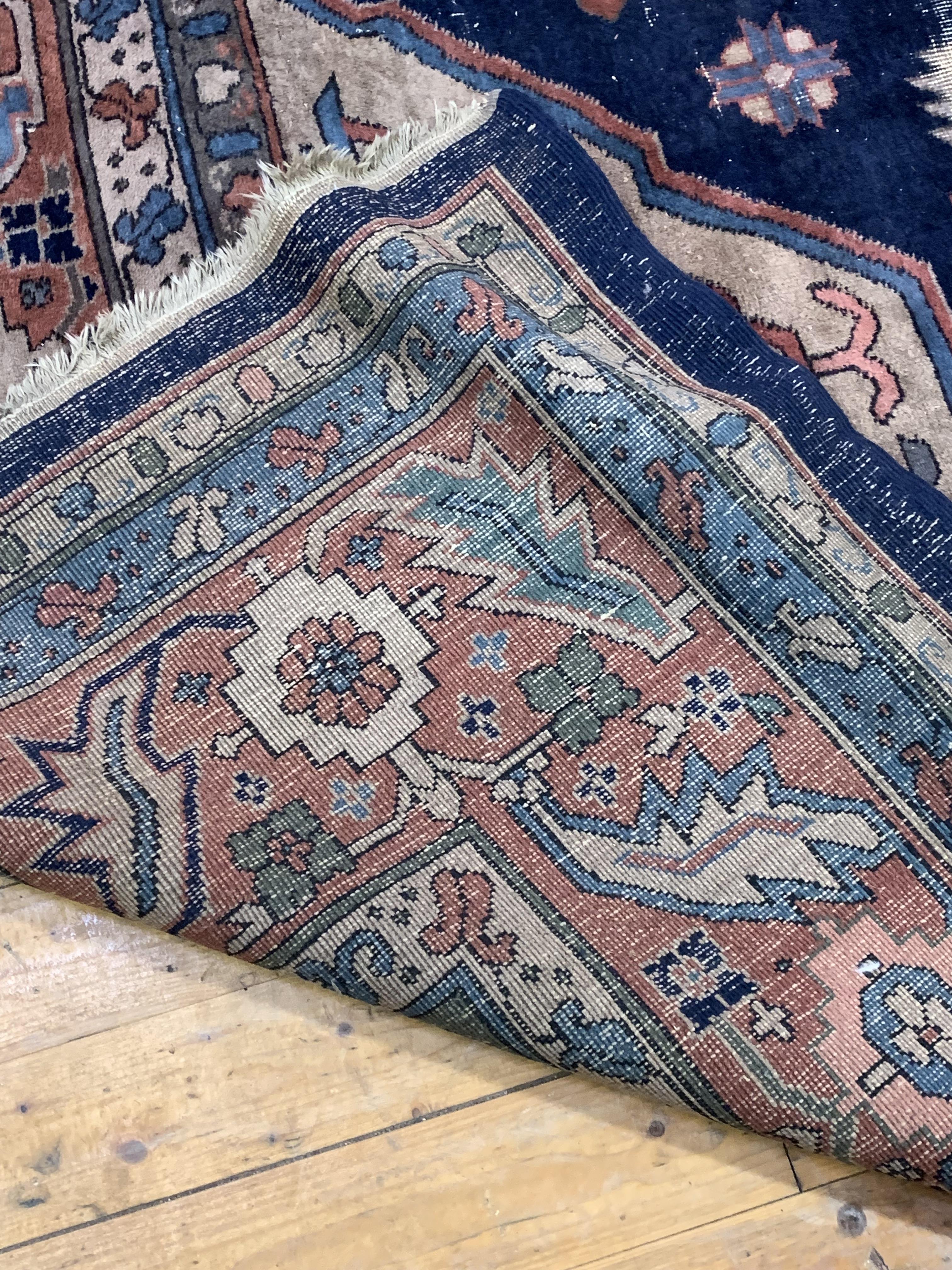 A Large Persian hand knotted carpet, the blue field decorated with geometric foliate framed within a - Image 5 of 5