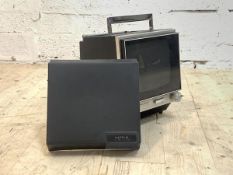 A vintage Sony solid state portable TV with plastic cover and carry handle, H31cm