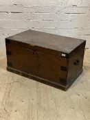 A 19th century stained pine blanket box with hinged lid and carry handle to each end, H43cm,