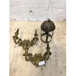 A pair of gilt brass twin branch wall sconces of Neoclassical design, the back plate with ribbon