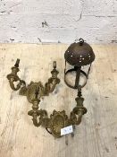 A pair of gilt brass twin branch wall sconces of Neoclassical design, the back plate with ribbon