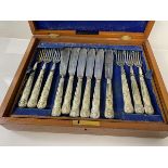 An early 20thc canteen, with Epns handles, including a set of twelve fish knives and forks,