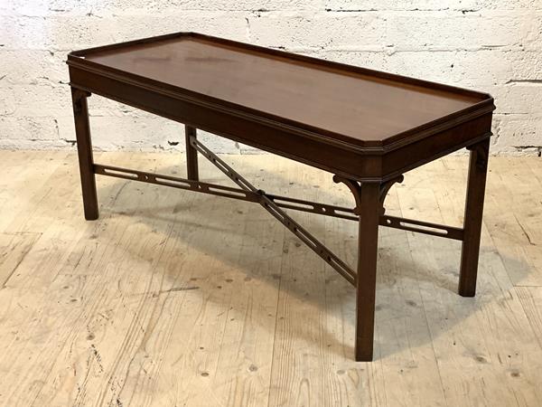 Arthur Brett, A mahogany low tale, the tray top with canted corners, raised on square chamfered