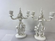 A pair of Copelands china candelabra, retailed by Thomas Goode each of overall foliate form with two