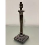 An Edwardian Epns Corinthian column oil lamp base on stepped square base, converted to