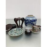 A group of five various Chinese hardwood stands, a blue and white decorated ginger jar, a Canton