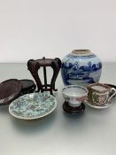 A group of five various Chinese hardwood stands, a blue and white decorated ginger jar, a Canton