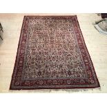 A North West Persian design rug with foliate motif field within border with multiple flowerheads, (