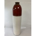 A large West German floor vase of bullet form with flared rim, brown, red and white glazed (61cm)