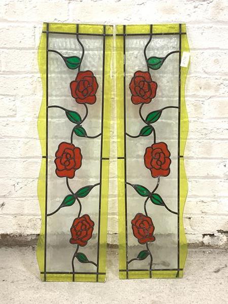 A Pair of leaded stained glass panels depicting vining roses, 94cm x 26cm
