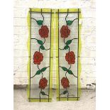 A Pair of leaded stained glass panels depicting vining roses, 94cm x 26cm