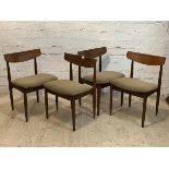 A set of four mid century teak dining chairs, with curved back rest, upholstered seats, raised on