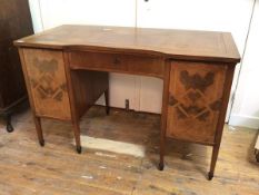 An early 20th century German mahogany desk, the top with inset gilt tooled leather writing surface