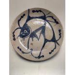 A Chinese Quing Dynasty dish decorated with carp, signed to front in underglaze blue (d.23cm)