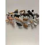 A collection of lead painted farmyard animals including Fresian and Hereford cows, Turkeys, Geese,